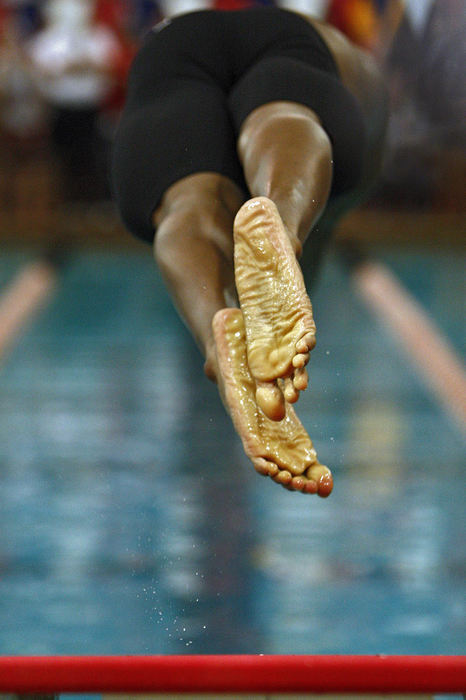 Award of Excellence, Sports Portfolio - Kyle Robertson / The Columbus DispatchBishop Hartley's Ronnie Bolden jumps off the block during the Mens 50 Yard Freestyle Division 2 at C.T. Branin Natatorium in Canton, February 24, 2012.  Bolden won the event.