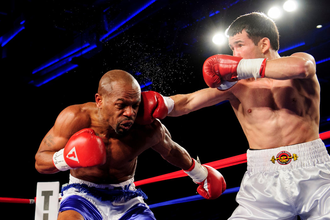 First place, Sports Portfolio - Joel Hawksley / Ohio UniversityA boxer lands a punch during the main event on March 1, 2012 at the Arnold Sports Festival in Columbus.