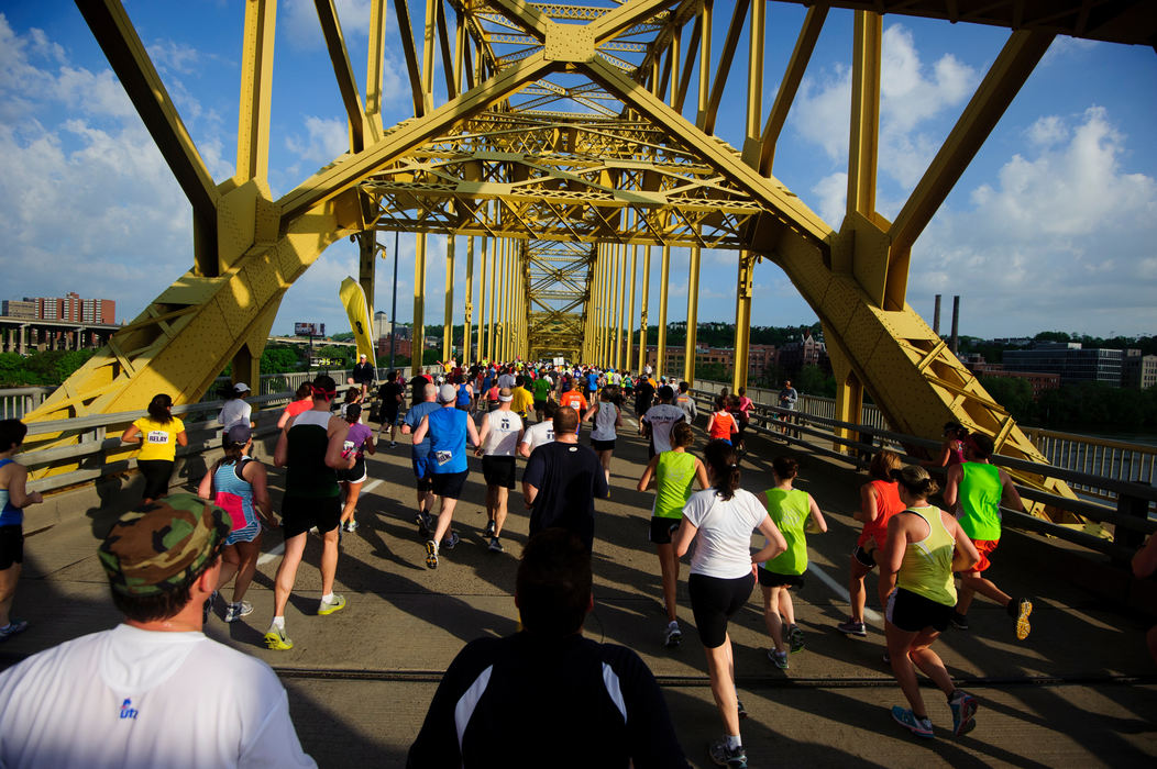 First place, Sports Portfolio - Joel Hawksley / Ohio UniversityRunners make their way across the 16th street bridge during the Pittsburgh Marathon.