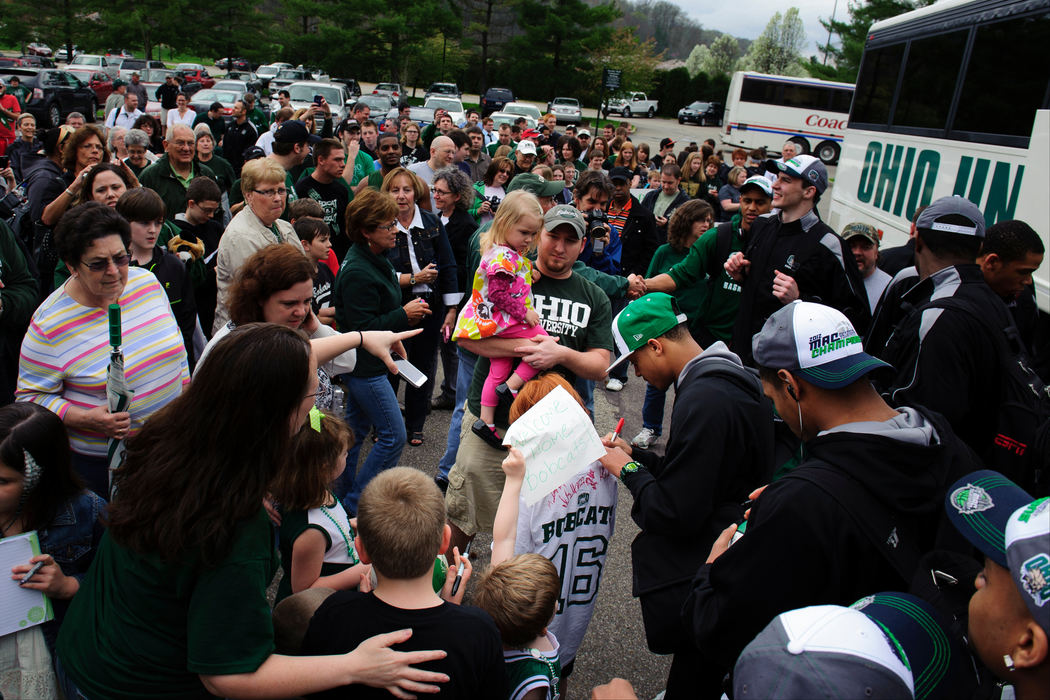 First place, Sports Portfolio - Joel Hawksley / Ohio UniversityOhio fans greet the Bobcats on their arrival back home at The Convo in Athens.