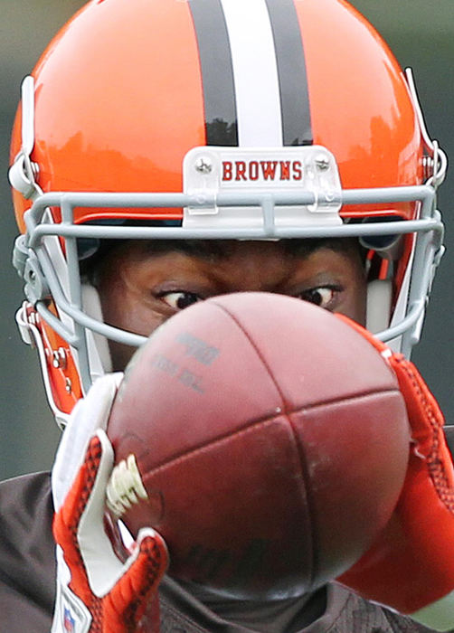 Award of Excellence, Sports Portfolioa - John Kuntz / The Plain DealerCleveland Browns receiver Carlton Mitchell eyes a pass to his hands May 22, 2012 during the Browns off-season workout program in Berea.  