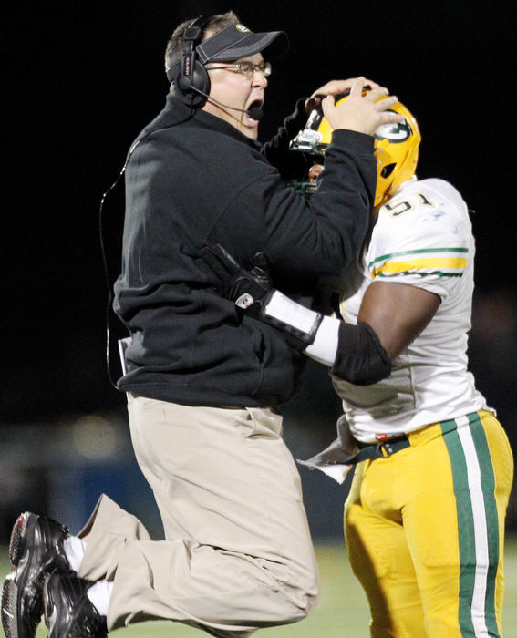 Award of Excellence, Sports Portfolio - John Kuntz / The Plain DealerSt. Edward head coach Rick Finotti leaps into the arms of Lavonte Robinson after the Eagles secured a fumble out of the hands of St. Ignatius quarterback Michael LaManna in the third quarter October 27, 2012 at Byers Field in Parma.  