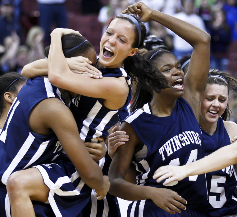 Award of Excellence, Sports Portfolio - Barbara J. Perenic / Springfield News-SunChar'Dell Dunningan (11), Nichole Mabry (15),  LaShawna Gatewood (14) and Mercedes Hobbs (35) of Twinsburg celebrate a 57-51 win over Kettering Fairmont in the Division I basketball championship game.