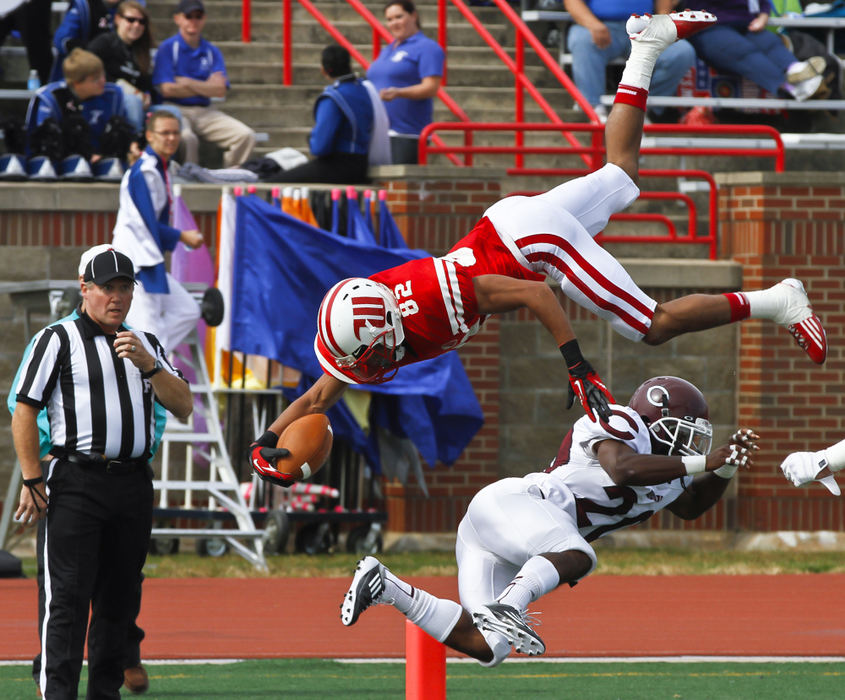 Award of Excellence, Sports Portfolio - Barbara J. Perenic / Springfield News-SunDesi Kirkman (82) of Wittenberg somersaults over Mychael Gilliam (20) of Chicago.