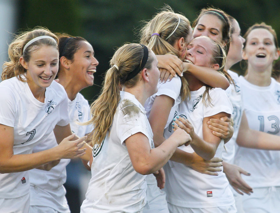 Award of Excellence, Sports Portfolio - Barbara J. Perenic / Springfield News-SunEmma Felty (1) of Catholic Central is mobbed by teammates after scoring with less than a minute left during Tuesday's game to upset rival Greeneview at Hallinean Field, winning the conference title outright for the first time in over a decade.