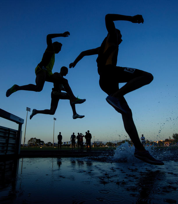 First place, Sports Portfolio - Joel Hawksley / Ohio UniversityCompetitors in the men's 3000m steeplechase leap into the water on the first lap during the Steve Scott Invitational at UC Irvine in Irvine, CA.