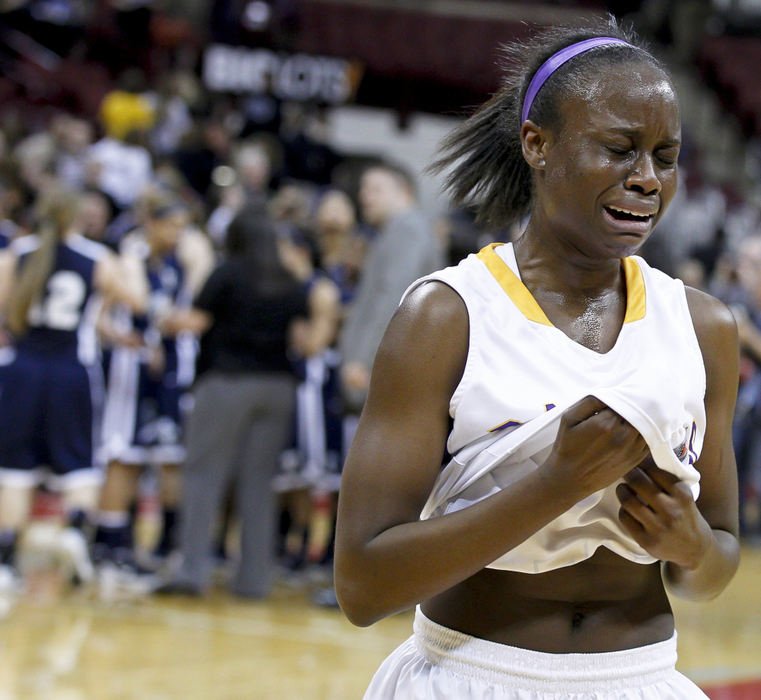 Award of Excellence, Sports Portfolio - Barbara J. Perenic / Springfield News-SunAdesuwa Aideyman (23) of Reynoldsburg reacts to a 49-41 loss to Twinsburg during a Division I semi-final basketball game.