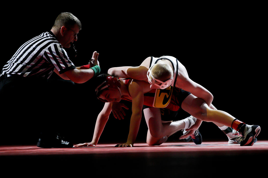 Award of Excellence, Sports Portfolio - Barbara J. Perenic / Springfield News-SunDavid Bavery of Massillon Perry wrestles Austin Assad of Brecksville-Broadview Heights at 106 lbs. in Division I during the finals of the OSHAA State Wrestling Tournament.