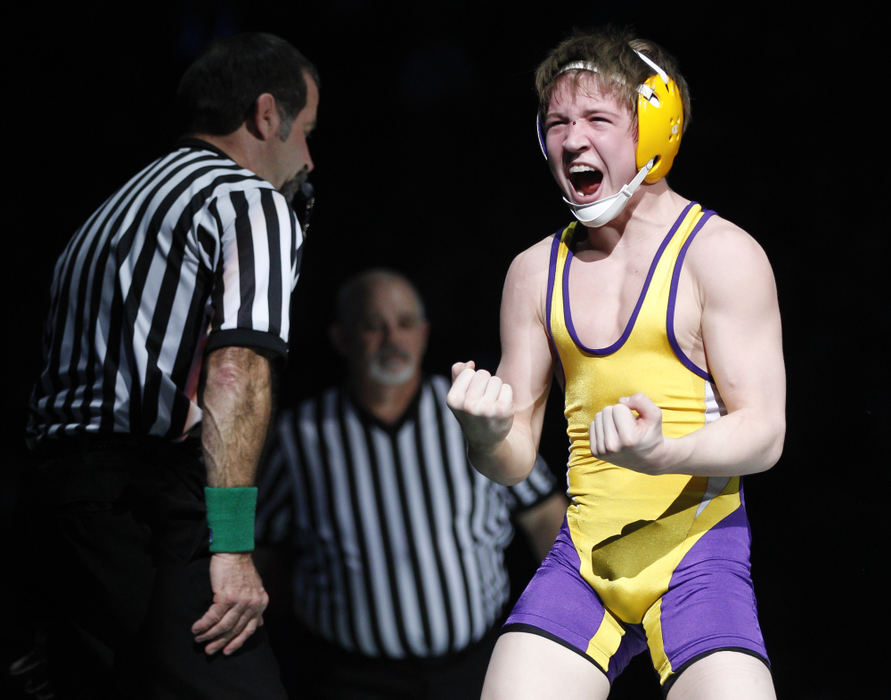Award of Excellence, Sports Portfolio - Barbara J. Perenic / Springfield News-SunCameron Kelly of Bellbrook celebrates a win over Cody Burcher of Uhrichville Claymont at 106 lbs. in Division II during the finals of the OSHAA State Wrestling Tournament.
