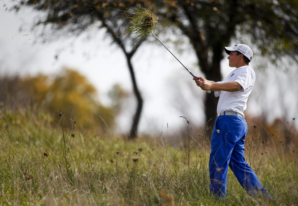 Award of Excellence, Sports Portfolio - Eamon Queeney / The Columbus DispatchGrove City Christian junior Cameron Michalak gathers a clump of grass as he hits on to the fairway on the 11th hole during the final day of the Division III boys high school state tournament at the NorthStar Golf Club, Saturday afternoon, October 13, 2012. Michalak shot 73 - 78 for a two-day total of 151 which was good for second place in the individual Division III competition. 