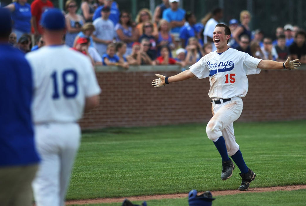 Award of Excellence, Sports Portfolio - Eamon Queeney / The Columbus DispatchOlentangy Orange Brai Beckel (15) celebrates as he rounds home on a walk off three run homer to defeat Thomas Worthington 7 - 6 in the bottom of the seventh inning, Wednesday afternoon, May 23, 2012. The Olentangy Orange defeated the Thomas Worthington Cardinals 7 - 6 in the Division I baseball regional semifinal at Dublin Coffman High School. 