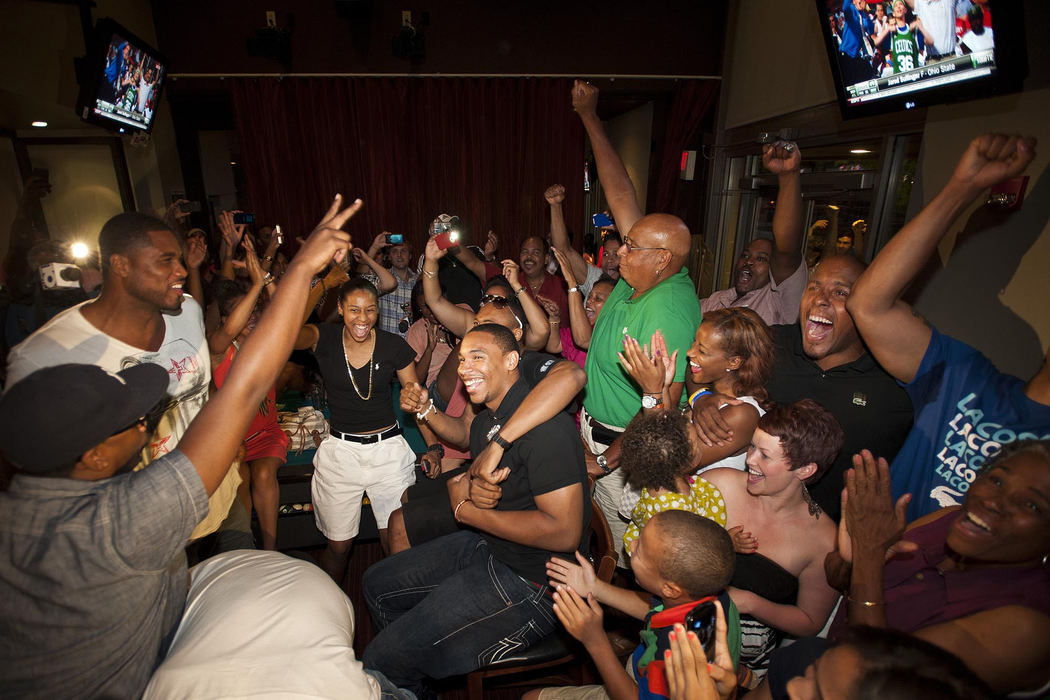 Award of Excellence, Sports Portfolio - Eamon Queeney / The Columbus DispatchA private party full of friends and family reacts as Jared Sullinger, center, is picked by the Boston Celtics as the 21st overall pick in the 2012 NBA draft at Eddie George's Grill near the Ohio State University campus, Thursday evening, June 28, 2012. 