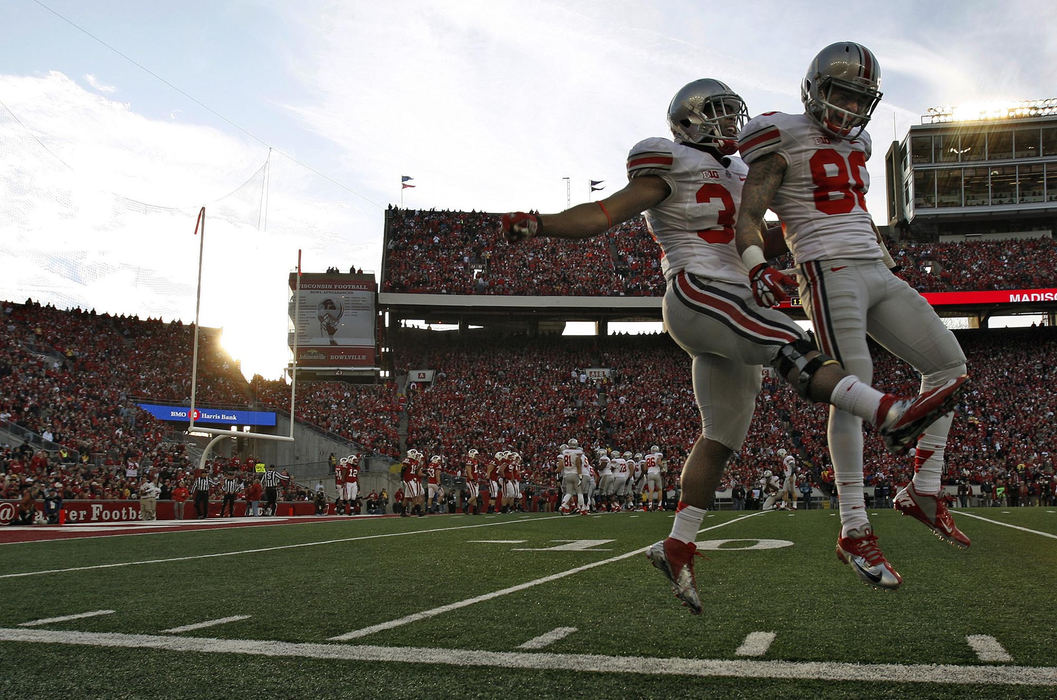 Award of Excellence, Sports Portfolio - Kyle Robertson / The Columbus DispatchOhio State Buckeyes running back Carlos Hyde (34) celebrates with Ohio State Buckeyes wide receiver Chris Fields (80) after scoring a rushing touchdown against Wisconsin Badgers in the 2nd quarter of their college football game at Camp Randall Stadium in Madison, Wis, November 17, 2012.  