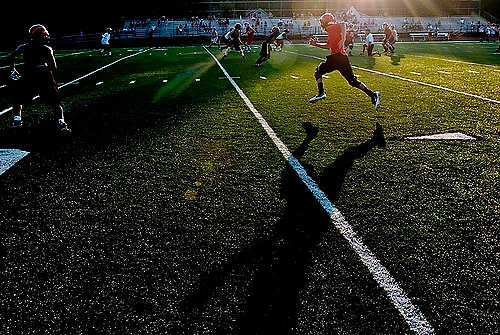 Second place, Student Photographer of the Year - Hannah Potes / Kent State UniversityA Hanover Horton High School football player sprints across the field during a 7x7 passing scrimmage at Dungy Field in Jackson, MI.