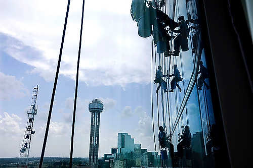 First place, Student Photographer of the Year - Meg Roussos / Ohio University City Wide window washers clean the outside of the Omni Dallas Hotel. 