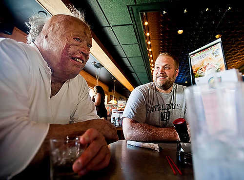 Second place, Student Photographer of the Year - Hannah Potes / Kent State UniversityKlavon eats a father's day meal with his second oldest son, Corey, left. At the time of the crash, Corey, 8, and his older brother Allen, 9, pulled their unconscious sister Erin, 4, from the burning vehicle, saving her life. Corey and Allen were the only passengers of the vehicle not injured in the crash.