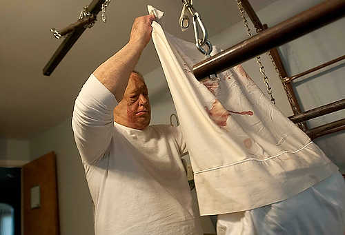 Second place, Student Photographer of the Year - Hannah Potes / Kent State UniversityKlavon changes the bloody bedding from his father Walter's bed after wounds from a difficult oral surgery tore open in the middle of the night. He cares for Walter every day, cooking him three balanced meals a day. “I was 13 years old at the time, so I was thrust into the position of being the man of the house,” Klavon said. “So I’ve been taking care of the home here for many years.”