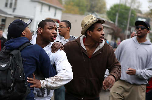 Third place, Student Photographer of the Year - Coty Giannelli / Kent State UniversityA group of partygoers attempts to calm down their friend. As the party continued tensions were raised and alcohol fueled fights started to break out all over College Avenue.