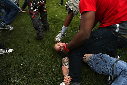 Third place, Student Photographer of the Year - Coty Giannelli / Kent State UniversityThe group of men who attacked this man continued to hit and kick him after he had lost consciousness.