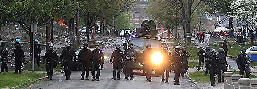 Third place, Student Photographer of the Year - Coty Giannelli / Kent State UniversityA police task force lined up at the end of College Avenue. By 7 p.m. police officers, with the help of less-than-lethal munitions, had forced College Fest participants off the street and by the end of the day had arrested over 30 people.