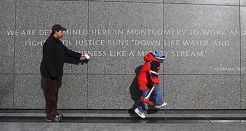 Third place, Student Photographer of the Year - Coty Giannelli / Kent State UniversityJuanice Johnson tries to tell her 6-year-old son, Modou Jaye, about the important role that Martin Luther King, Jr. played during the Civil Rights Movement, as he hops from square to square at the Martin Luther King, Jr. National Memorial during the MLK Day celebration. This was the first MLK Day the memorial has been open on since construction was finished in August.