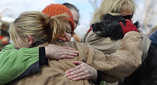 Third place, Student Photographer of the Year - Coty Giannelli / Kent State UniversityCommunity members embrace as Elain Vienna hugs her thirteen-year-old dog, Ben, after he is pulled from what is left of her house after a tornado tore through Henryville, Indiana. Ben had been missing since the tornado touched down and was thought to be dead.