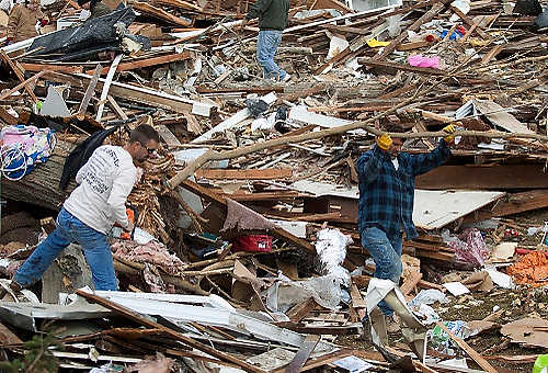 Third place, Student Photographer of the Year - Coty Giannelli / Kent State UniversityAlmost immediately after tornadoes tore through southern Indiana, workers began clearing what was left of their homes so they could begin the rebuilding process.