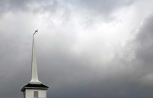 Third place, Student Photographer of the Year - Coty Giannelli / Kent State UniversityA cross still attached to the steeple of a church in Marysville, Indiana after tornadoes touched down. The winds from the tornadoes were so powerful that debris from Marysville was found in Ohio and Kentucky.