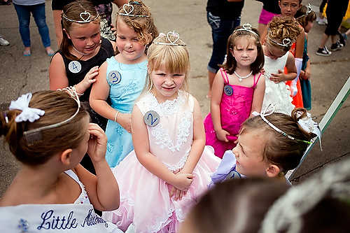 Award of Excellence, Student Photographer of the Year - Meg Vogel / Ohio UniversityMalakhai Robinette, 8 of Athens, waits behind the Old Settlers Reunion stage with the other Little Miss pageant contestants in Jacksonville, Ohio. She was later crowned Little Miss 2012-2013.