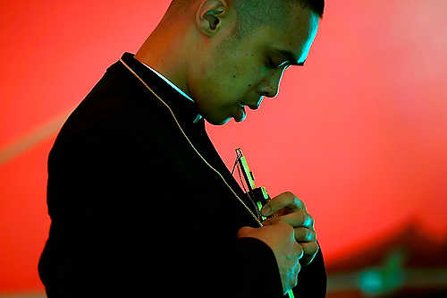 Award of Excellence, Student Photographer of the Year - Meg Vogel / Ohio UniversityFr. Jewel Aytona of Southern California adjusts his cross after beatboxing about resisting sin, during his seminar at Lifest, an annual Christian rock festival at the Sunnyview Expo Center in Oshkosh, Wisconsin. 