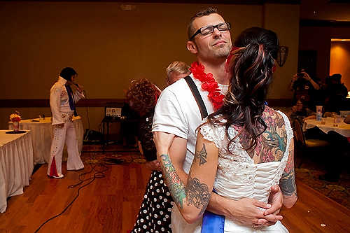 Award of Excellence, Student Photographer of the Year - Meg Vogel / Ohio UniversityKyle and Tara Schreckengost dance for the first time as a married couple, as Jim Forshey, a second generation Elvis tribute artist, sings "Hawaiian Wedding Song" at the Grand Pointe Reception Center in Vienna, West Virginia. 