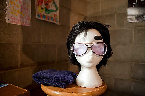 Award of Excellence, Student Photographer of the Year - Meg Vogel / Ohio UniversityJim Forshey's wig and sunglasses are displayed in his basement, where he practices twice a week. He will only wear the wig when he is performing because he doesn't want people to think of him as the Elvis guy, when he is not performing. 