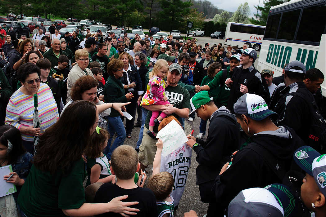 Second place, Sports Picture Story - Joel Hawksley / Ohio UniversityOhio fans greet the Bobcats on their arrival back home at The Convo in Athens, Ohio.