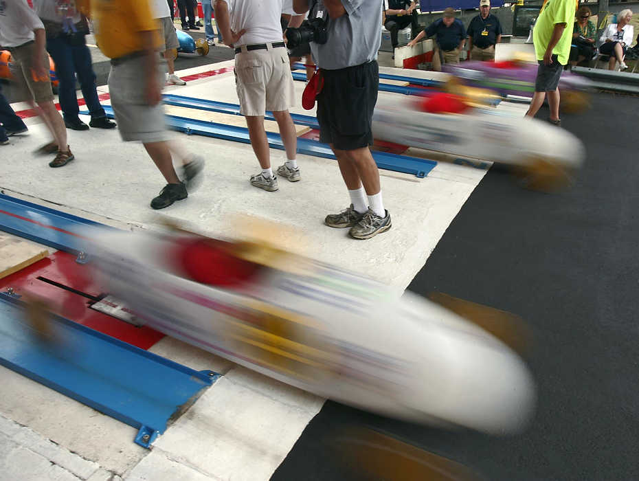 First place, Sports Picture Story - Ed Suba, Jr. / Akron Beacon JournalRacers start down the hill while competing in their heat during the 75th annual FirstEnergy All-American Soap Box Derby at Derby Downs.