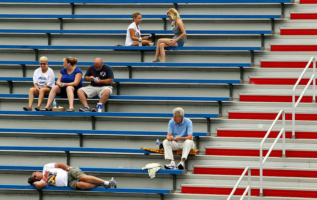 First place, Sports Picture Story - Ed Suba, Jr. / Akron Beacon JournalSpectators sit in the bleachers while watching the racers run their heats during the 75th annual FirstEnergy All-American Soap Box Derby at Derby Downs.