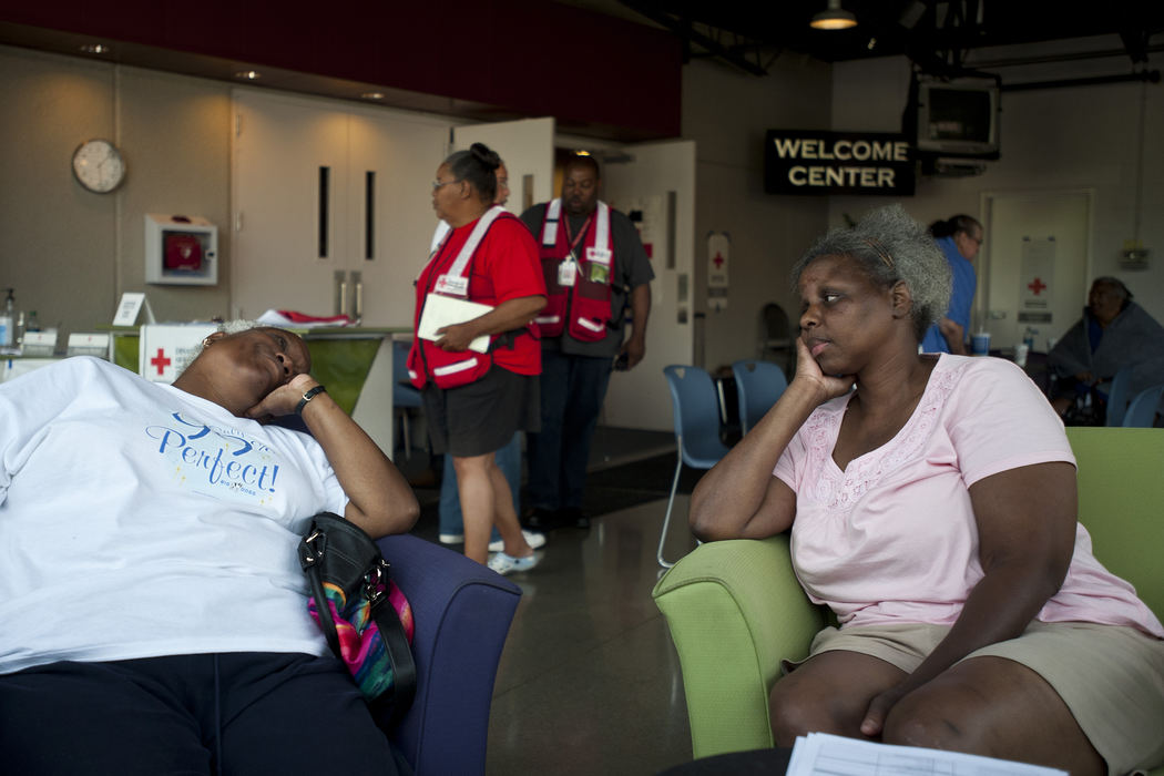 Second place, Team Picture Story - Eamon Queeney / The Columbus DispatchNeighbors Shirley Franklin, 62, left, and Kay Burke, 50, right, both of the East Side share a moment in the Red Cross emergency shelter and cooling center at Peace Lutheran Church in Gahanna, Friday afternoon, July 6, 2012. The pair were still without electricity a week after the June 29 storm that knocked out power to thousands all over Ohio and came to the shelter to cool off and have lunch. 