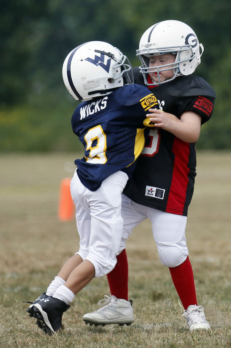 Second Place, Feature Picture Story - Eric Albrecht / The Columbus DispatchMurphy Vetter 11 gets blocked by Mountaineer Jeremy Wicks 9. 