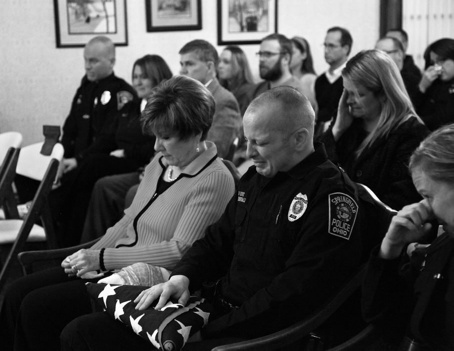 Award of Excellence, Feature Picture Story - Barbara J. Perenic / Springfield News-SunOfficer Mike Fredendall weeps during a memorial service for his partner, Rambo, the department's first K-9 officer. Rambo's watch ended January 31st, 2013, after a battle with cancer. 
