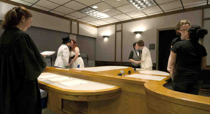 First Place, Larry Fullerton Photojournalism Scholarship - Jenna Watson / Kent State UniversityCouples share a kiss as they become the first three same-sex Polk County couples to be legally wed in Crookston, Minn. at midnight, Aug. 1, 2013. 