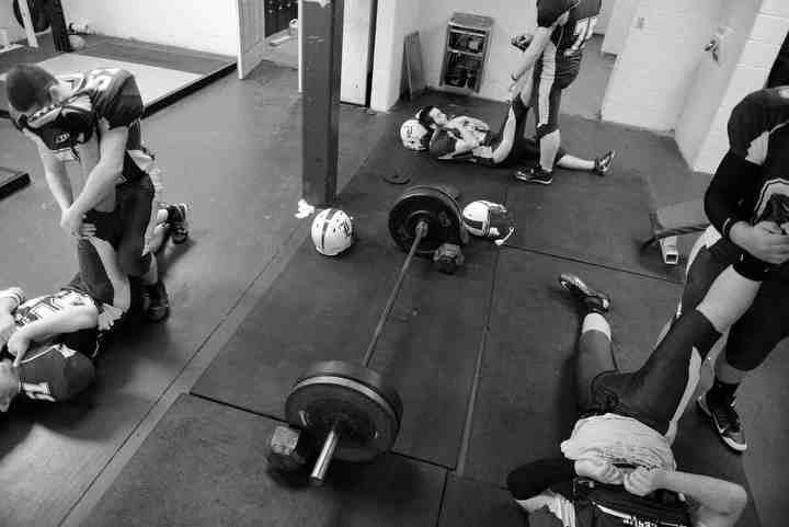 First Place, Larry Fullerton Photojournalism Scholarship - Jenna Watson / Kent State UniversityThe Leslie County Eagles' starting lineup stretches in the weightroom in Hyden, Kentucky before taking the field against Betsy Layne, Oct. 11, 2013. 