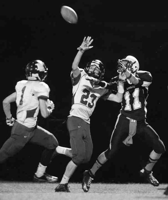 First Place, Larry Fullerton Photojournalism Scholarship - Jenna Watson / Kent State UniversityWide receiver James Brock (right) fights to receive the ball as a Betsy Layne opponent forced an incompletion during the second half of the game in Hyden, Kentucky.