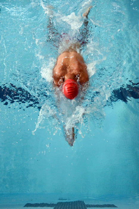 Second Place, Larry Fullerton Photojournalism Scholarship - Madison Schmidt / University of CincinnatiFreshman Trenton Harper extends his arms and finishes his last whip kick before turning into his final lap of the 100-yard breaststroke. The University of Cincinnati's Mens' and Womens' swim team held its annual intersquad meet at the Keating Aquatics Center.