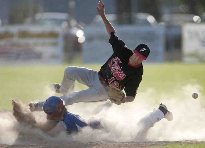 First Place, Larry Fullerton Photojournalism Scholarship - Jenna Watson / Kent State UniversityFargo shortstop Jake Salentine dives for a catch in attempt to tag East Grand Forks' Hunter Aubol, as he slides safely into second base during a game at Stauss Field in East Grand Forks, Minn.. East Grand Forks Legion Post 157 lost to Fargo Legion Post 2, with a final score of 3-6.