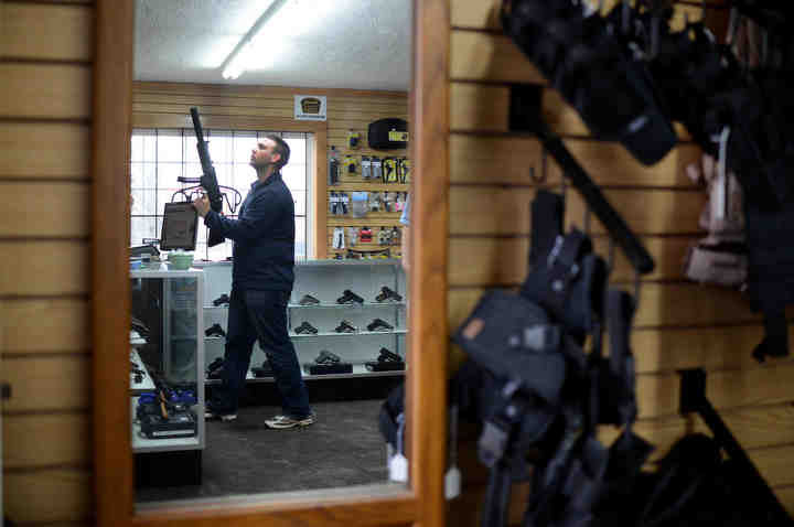 First Place, Larry Fullerton Photojournalism Scholarship - Jenna Watson / Kent State UniversityDiamond, Ohio resident Adam Nowak browses at Sporting Defense LLC. Larry John opened the gun shop in Brimfield, Ohio in August of 2012. John said sales had been higher than ever, especially due to the gun control debate resulting from the school shootings about a month prior in Connecticut. 