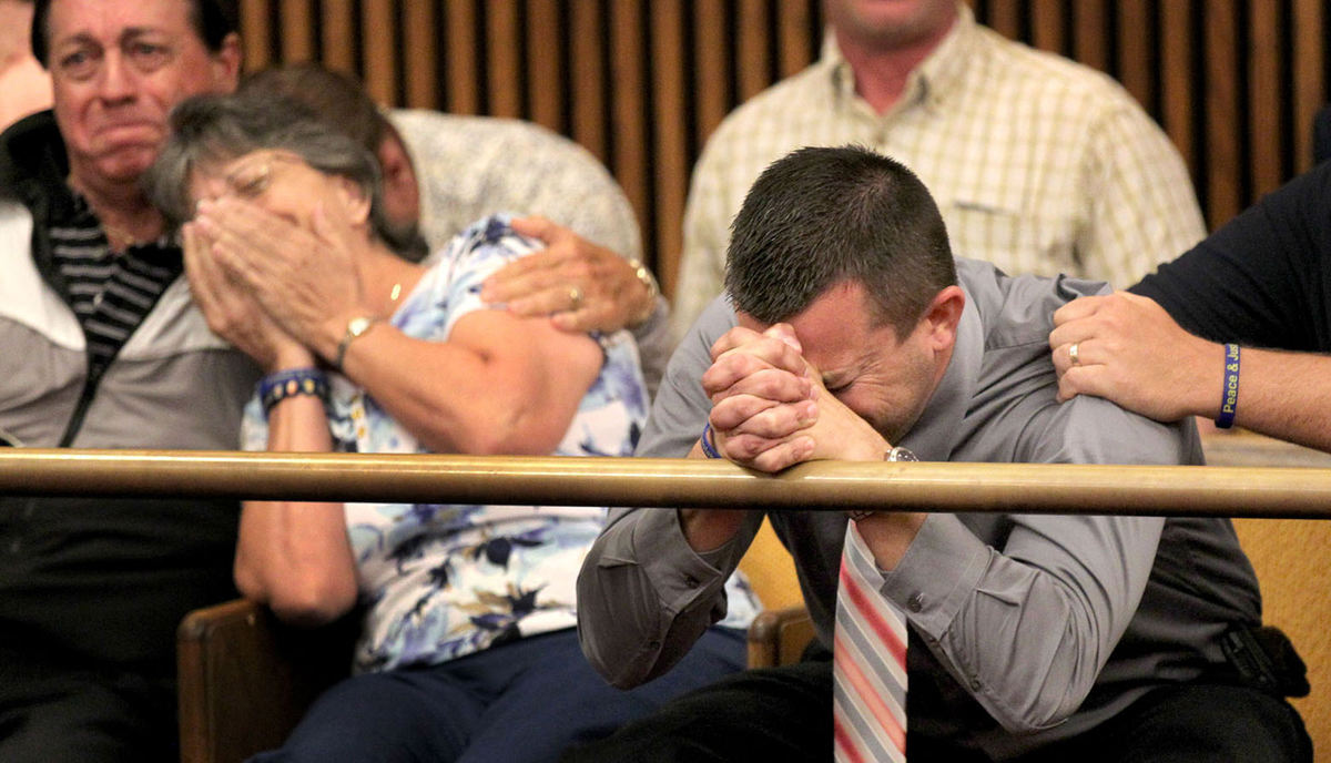 Award of Excellence, General News - Marvin Fong / The Plain DealerMark Podolak reacts after hearing that his former sister-in-law Holly McFeeture was found guilty in the anti-freeze poisoning death of his brother, Matthew Podolak.   His mother, Patricia Romano, left, is embraced by relative Ralph Bottone.