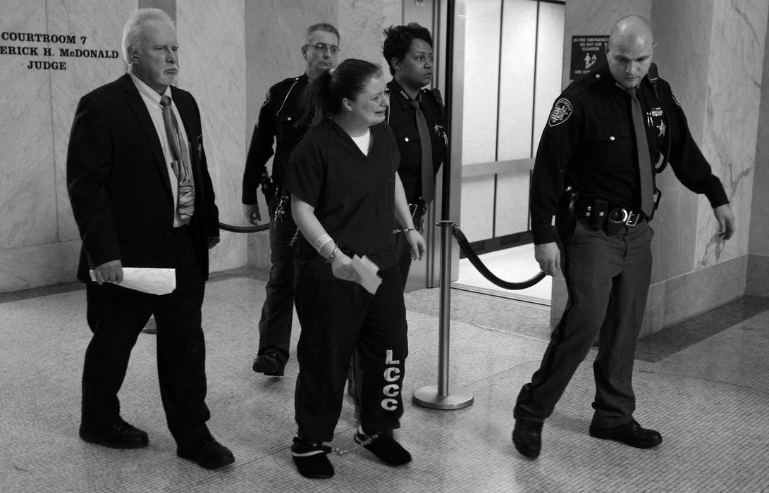 First Place, News Picture Story - Amy E. Voigt / The (Toledo) BladeAngela Steinfurth cries as she arrives for her hearing in Lucas County Common Please Court in Toledo, Tuesday, December 3, 2013. Steinfurth, who was charged with murder in the death of her daughter Elaina, entered an Alford plea.  The Blade/Amy E. Voigt