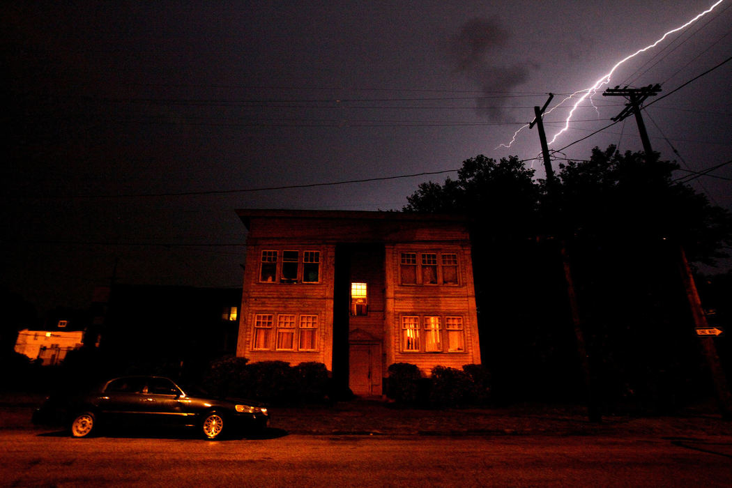 Third Place, News Picture Story - Lisa DeJong / The Plain DealerReinvestigating Rape (Synopsis): They stalked Cleveland’s East Side 20 years ago, ambushed women or girls as they walked along city streets, dragged them into the backyards of blighted houses, into wooded areas and garbage-strewn lots, and raped them. The serial rapists were never caught. But they left behind their DNA. Collected from each victim at local hospitals as part of a “rape kit”, the DNA remained untested alongside hundreds of others that would wait nearly two decades to tell their secrets. The Cleveland Police Department's dismissive approach was to shelve and forget thousands of rape kits that contained DNA evidence collected from survivors. The callous indifference and ineptitude of the Cleveland Police Department enabled a rape culture to flourish. Cuyahoga County prosecutors and investigators are now revisiting decades-old unsolved rape cases, using DNA evidence to connect serial rapes, tracking down victims and sending cases to grand juries for indictment -- often racing against a 20-year statute of limitations. Now, after forensic testing, the kits are yielding results, linking cases to each other and to DNA profiles in databases. Each caption reveals the name of the rapist, each now indicted on the rape that happened near where the image was made. One attacker surprisingly confessed to two murders of long-missing women. The serial rapists walked free for two decades. Until now. More than 75 have been indicted in Cuyahoga County, with more than 500 cases being reopened. CAPTION for this FIRST IMAGE:  More than two decades after Cynthia Espey told police she was raped by serial rapist Michael Bass at knifepoint in this apartment building, her nightmare has ended. Police never tested her rape kit. The case was reopened this year after DNA evidence revealed that Bass had lied to police in a 1993 statement. Prosecutors indicted the case just TWO days before the 20-year statute of limitations on the rape case ran out. 