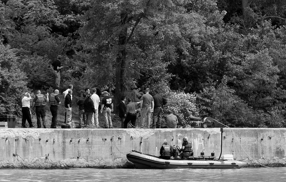 First Place, News Picture Story - Amy E. Voigt / The (Toledo) BladeAuthorities search the Maumee River for Elaina Steinfurth, 1, who went missing on Sunday.
