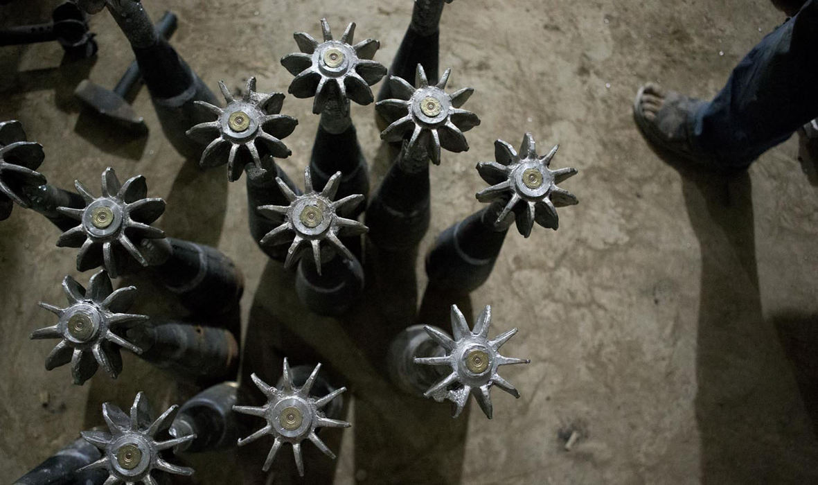 Award of Excellence, News Picture Story - Coty Giannelli / Kent State UniversityUnloaded shotgun shells are placed in the mortars and used to ignite the propellant packs that are wrapped around the base of the mortars before they are fired on June 22, 2013. These mortars are hand assembled in this factory and shipped out to fighters all over northern Syria.