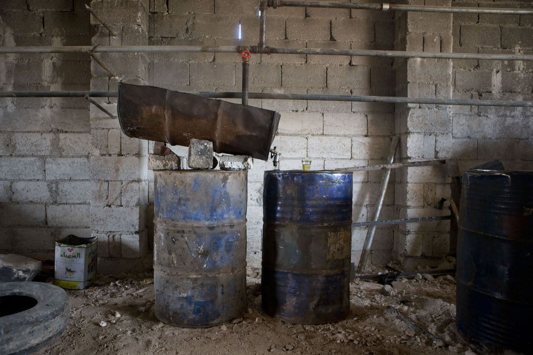 Award of Excellence, News Picture Story - Coty Giannelli / Kent State UniversityA makes-shift refinery in northern Syria on June 19, 2013. The Syria government controls all of the refineries in Syria so in order to get fuel, groups of rebels set up their own refineries throughout the country.  